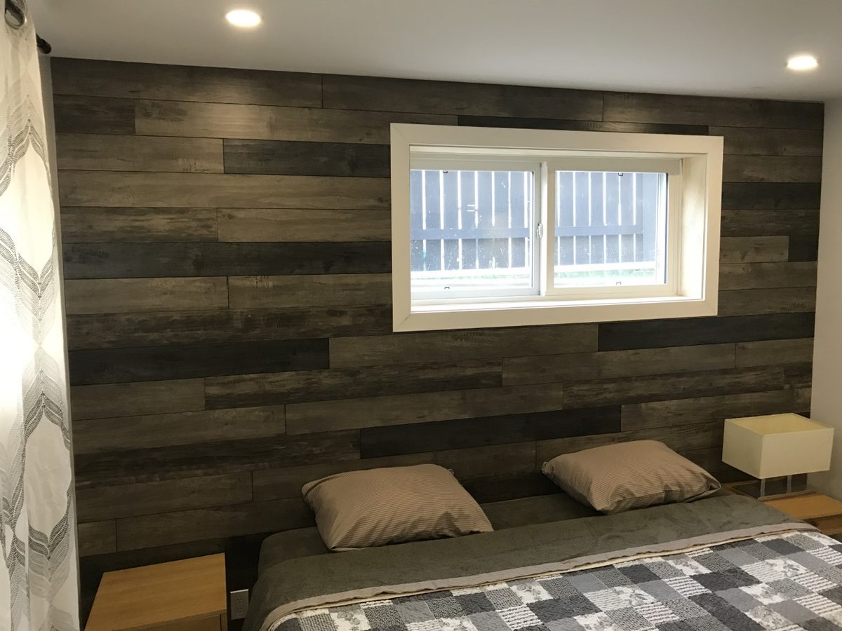 Maple planks used as a bedroom feature wall